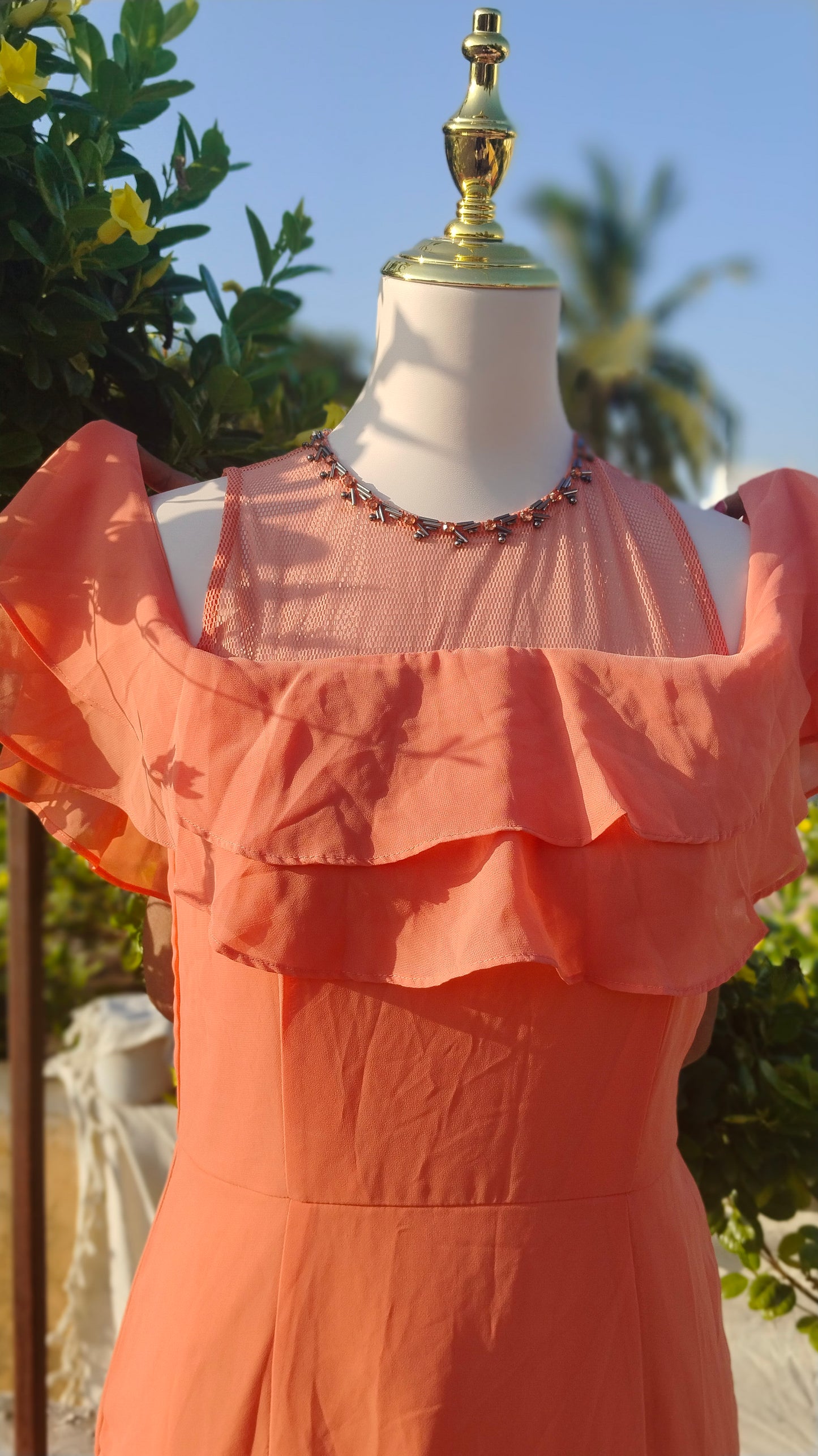 SLEEVELESS TIERED GOWN WITH RUFFLES