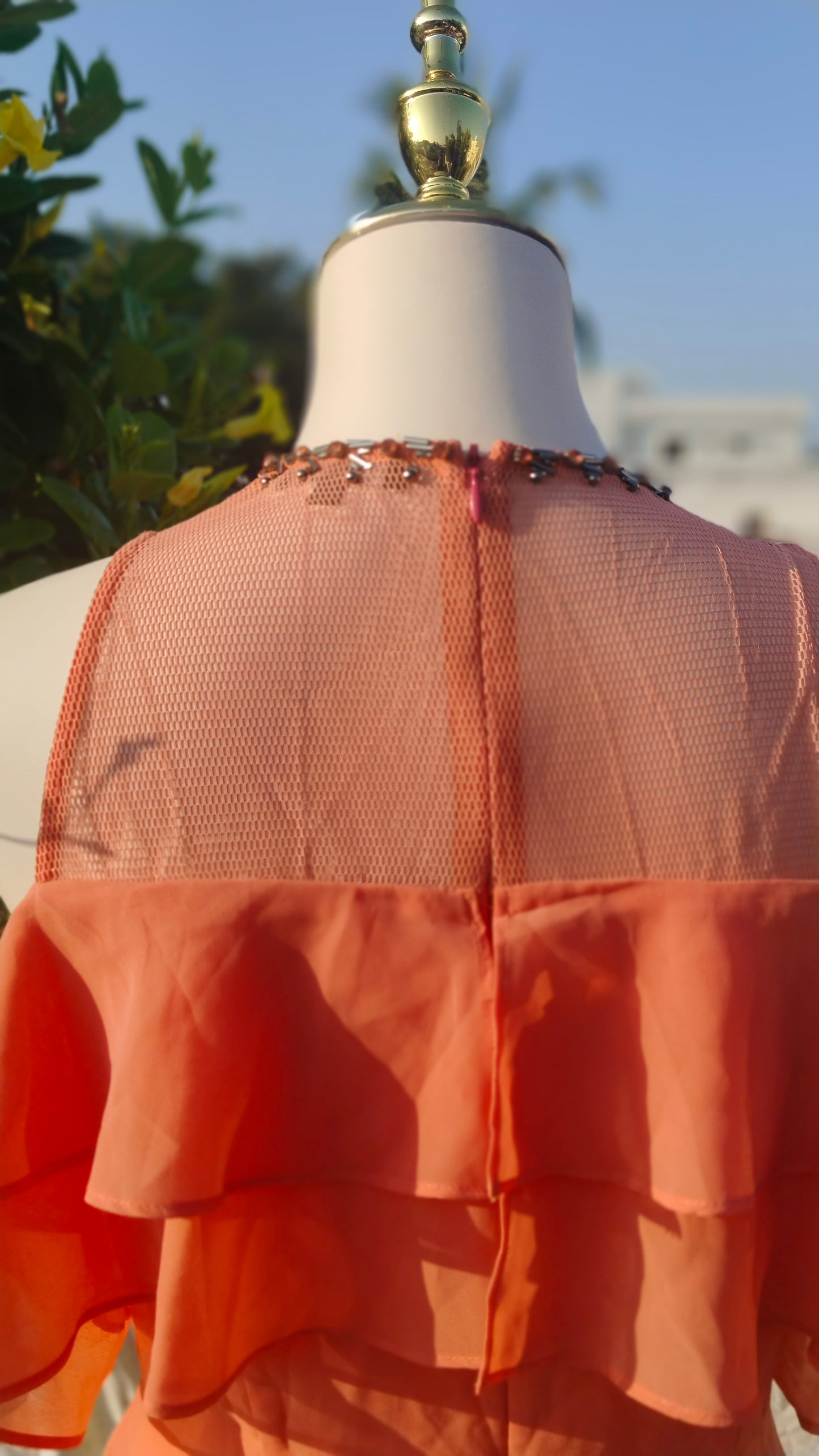 SLEEVELESS TIERED GOWN WITH RUFFLES