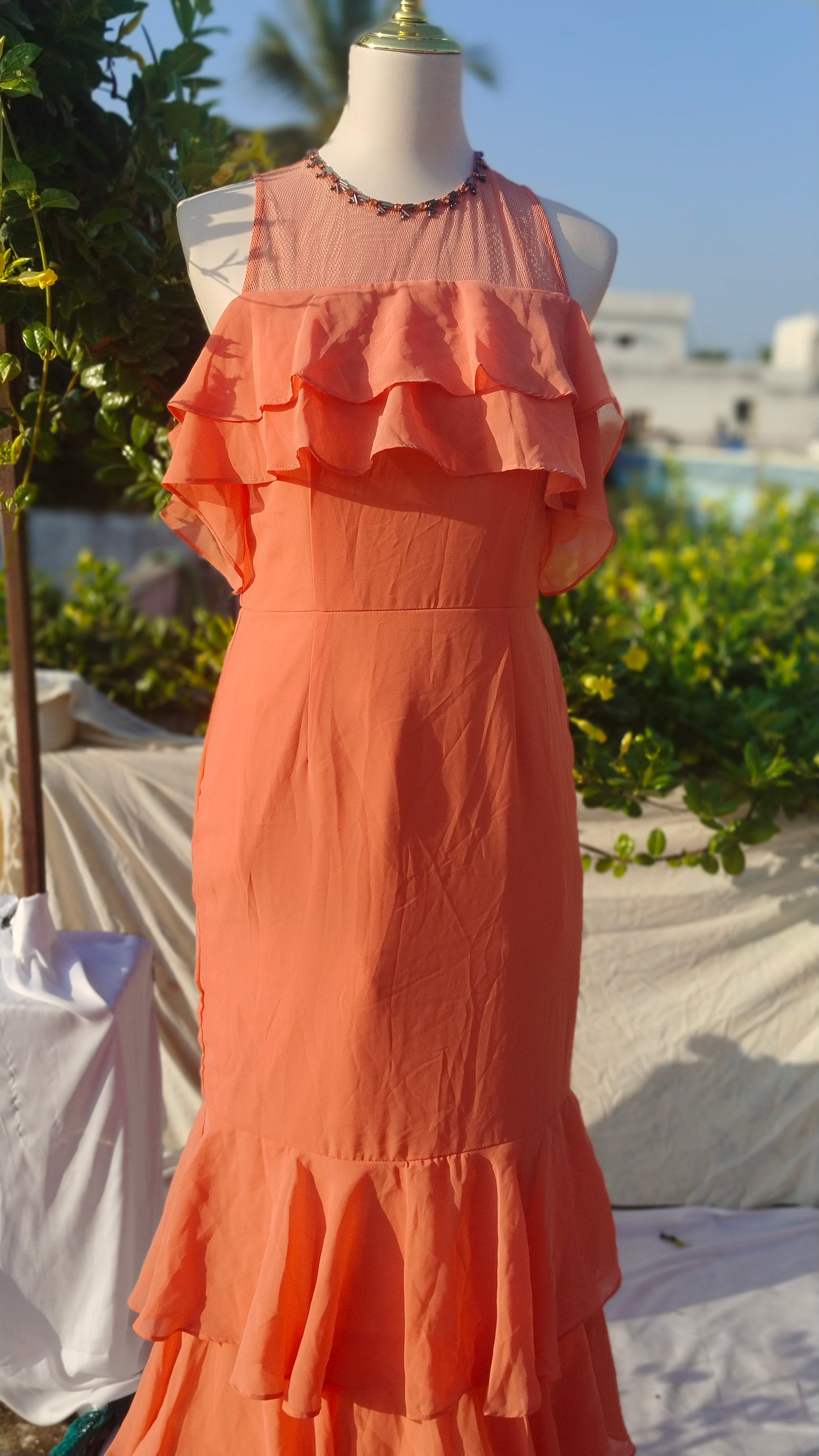 SLEEVELESS TIERED GOWN WITH RUFFLES